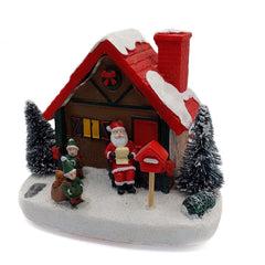 Christmas Cottage with Santa. Village