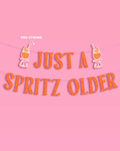 Just A Spritz Older Banner - orange glitter banner