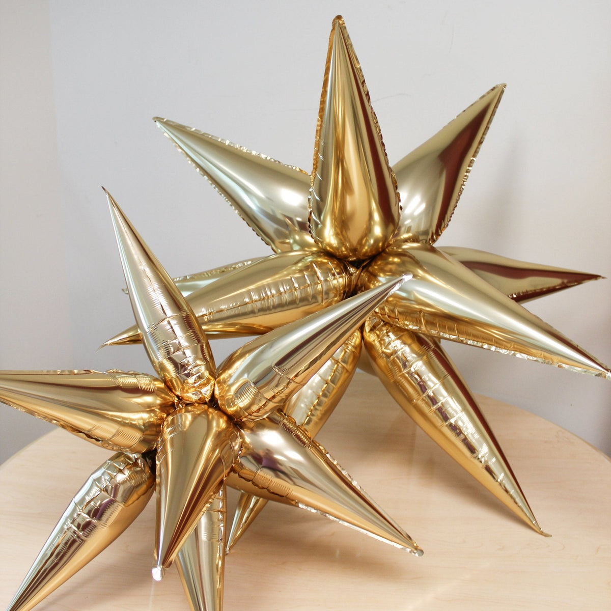 Silver Starburst Cluster Balloon | 12-Point Metallic Foil Star
